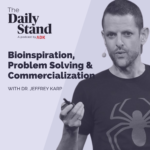 Purple graphic for The Daily Stand podcast. Dr. Jeffrey Karp is featured wearing a graphic tee shirt with a spider on it, a pinky ring and a headset. The text says: The Daily Stand, A podcast by ADK. Bioinspiration, Problem Solving & Commercialization with Dr. Jeffrey Karp.
