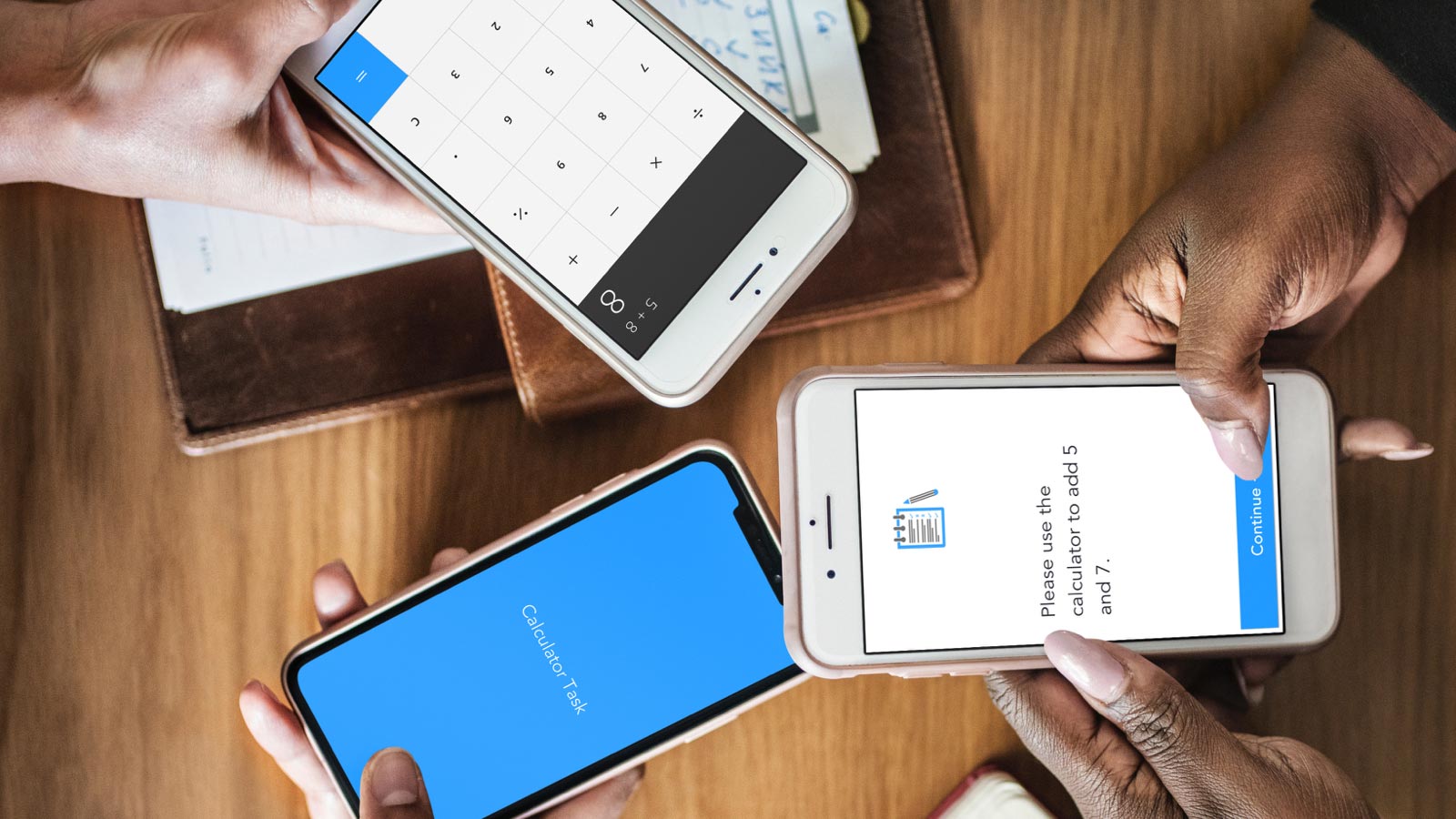 Three hands holding smartphones together in a huddle. One phone screen has a calculator pulled up that says 5+8. Another phone has a blue screen with