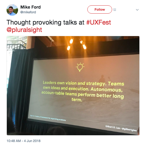 Mike Ford's tweet that says: Thought provoking talks at #UXFest @pluralsight. The associated image is of a large screen that has a quote on it, which says